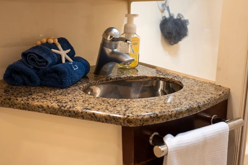 Slide: The Image of Luxurious bathroom sink in 2006 Sea Ray 455 Sedan Bridge yacht with granite countertop. - 20