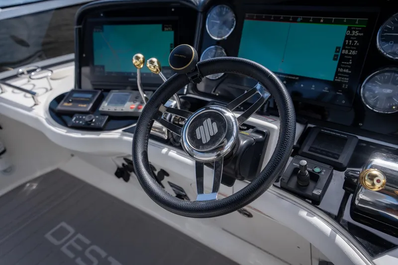 Slide: The Image of Steering wheel and controls of a 2006 Sea Ray 455 Sedan Bridge yacht. - 7