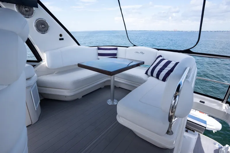 Slide: The Image of Luxurious 2006 Sea Ray 455 Sedan Bridge yacht with elegant seating and ocean view. - 38