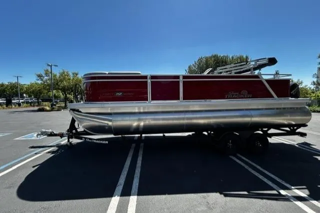 The Image of 2026 Sun Tracker Party Barge 22 RF XP3 pontoon boat parked outdoors. - 0