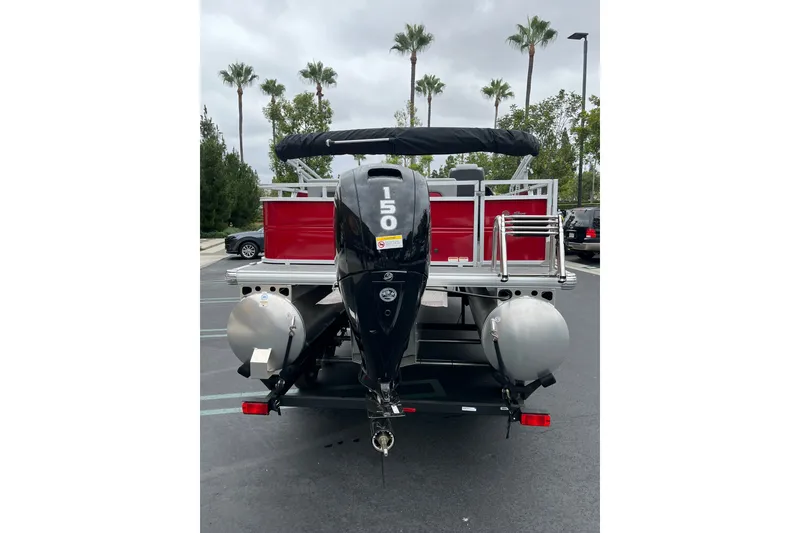 Slide: The Image of 2026 Sun Tracker Party Barge 22 RF XP3 pontoon boat with powerful outboard motor. - 2