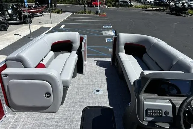 Slide: The Image of 2026 Sun Tracker Party Barge 22 RF XP3 interior with spacious seating in a parking lot. - 4