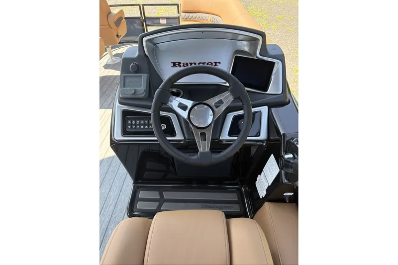 Slide: The Image of Steering console of 2026 Ranger 220FC boat with modern controls and display. - 9