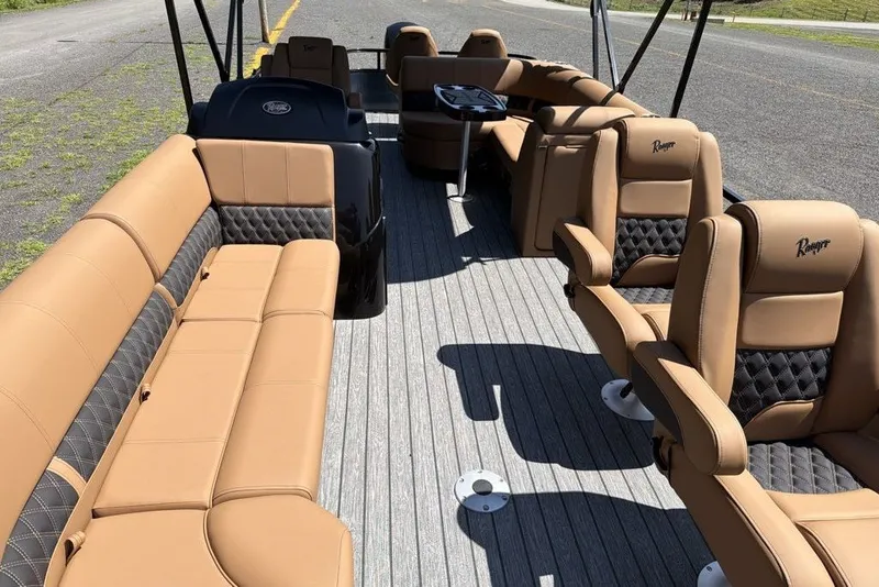 Slide: The Image of Luxurious interior of 2026 Ranger 220FC boat with tan and black seating. - 7