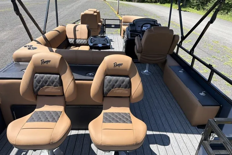 Slide: The Image of 2026 Ranger 220FC boat interior with tan leather seating and modern design. - 8