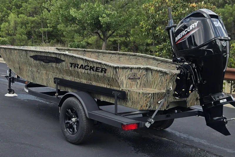 The Image of 2026 Tracker Grizzly 1650 T Prairie Wings Edition boat with Mercury engine on trailer. - 0