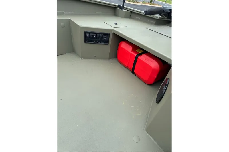 Slide: The Image of 2026 Tracker Grizzly 1650 T Prairie Wings Edition interior with red fuel tank and control panel. - 8