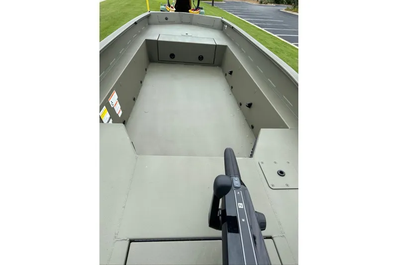 Slide: The Image of 2026 Tracker Grizzly 1650 T Prairie Wings Edition boat interior, showcasing spacious deck design. - 10