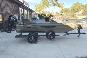The Image of 2026 Tracker Grizzly 1650 T Prairie Wings Edition boat on trailer, outdoors. - 0