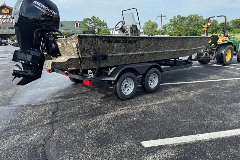 Slide: The Image of 2026 Tracker Grizzly 2072 CC boat on trailer, parked outdoors. - 3
