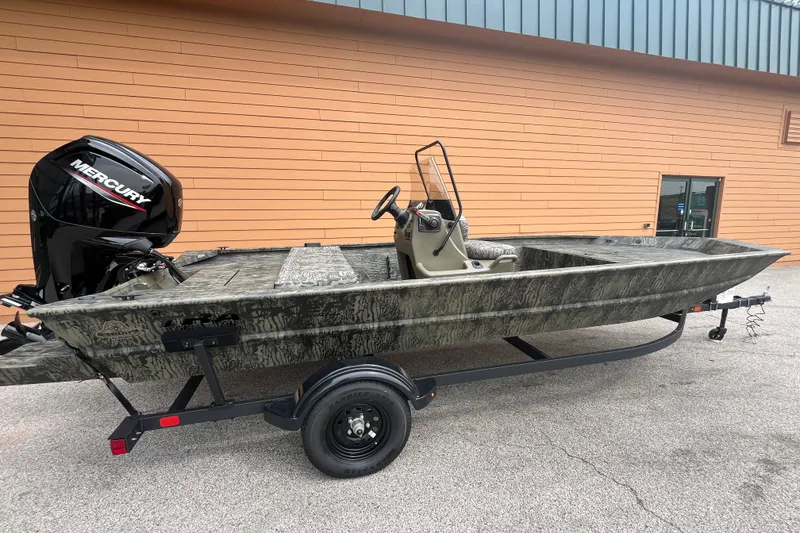 The Image of 2026 Tracker Grizzly 1860 CC boat with Mercury engine on trailer, parked outdoors. - 0