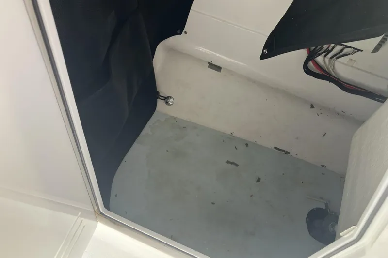 Slide: The Image of Interior view of a 2018 Edgewater 248CX Crossover boat compartment. - 14