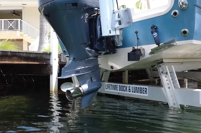 Slide: The Image of 2021 Grady-White 251 Coastal Explorer boat on lift, dockside view. - 7