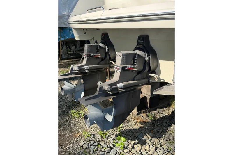 Slide: The Image of 2002 Formula 27 Performance Cruiser with dual Mercury outboard motors on gravel. - 22
