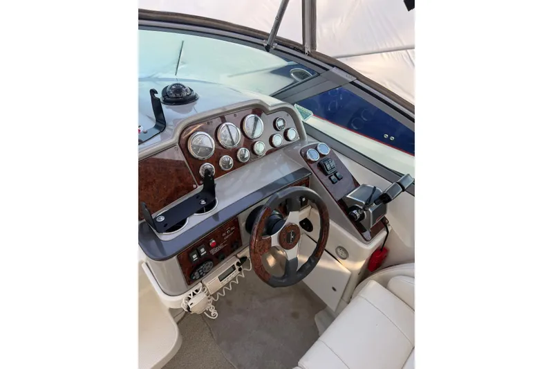 Slide: The Image of Cockpit of a 2002 Formula 27 Performance Cruiser with steering wheel and instrument panel. - 13