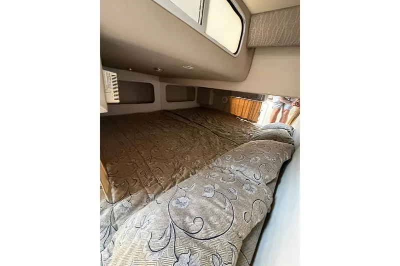 Slide: The Image of Interior cabin of a 2002 Formula 27 Performance Cruiser with patterned bedding. - 17