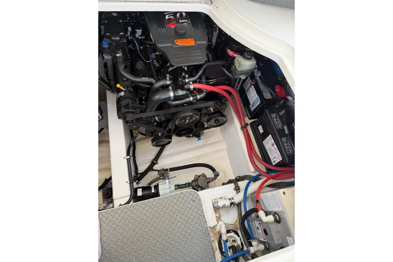Slide: The Image of Engine compartment of a 2002 Formula 27 Performance Cruiser with visible batteries and wiring. - 20