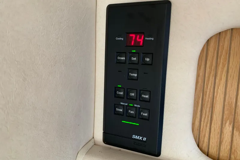 Slide: The Image of Thermostat control panel on 2000 Sea Ray Sundancer 310 boat, displaying temperature settings. - 29