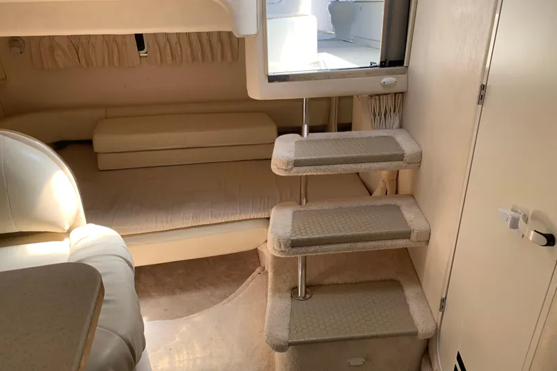 Slide: The Image of Interior of 2000 Sea Ray Sundancer 310 yacht with steps and seating area. - 30
