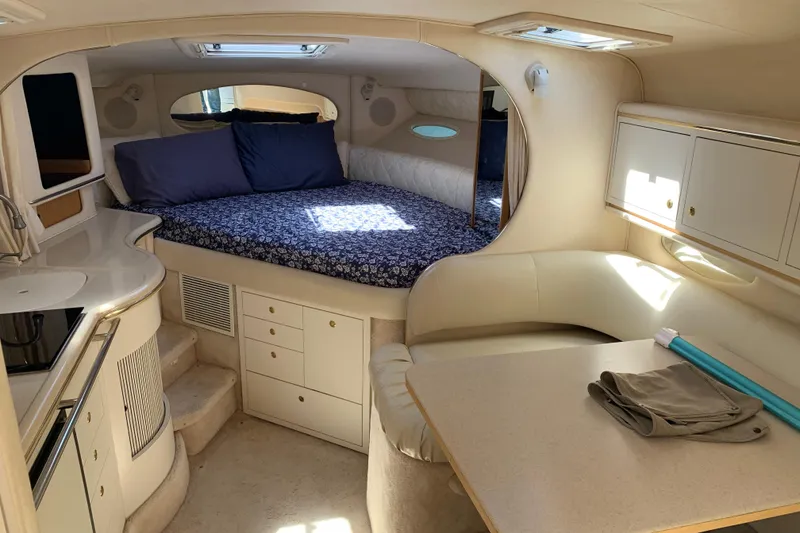 Slide: The Image of Interior of 2000 Sea Ray Sundancer 310 yacht with cozy bed and kitchenette. - 22