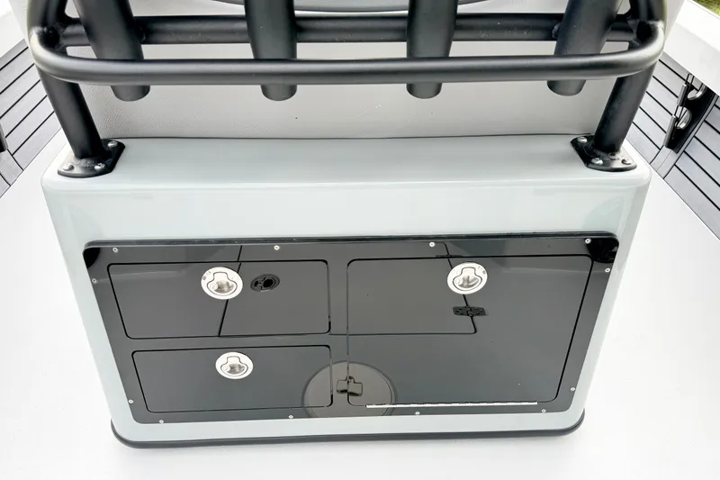 Slide: The Image of 2026 Pathfinder 2500 Hybrid boat storage compartment with secure latches and sleek design. - 12