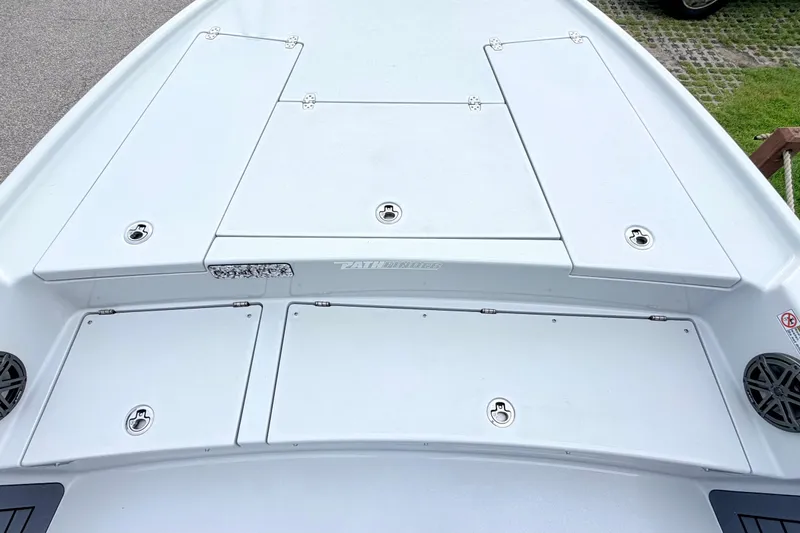 Slide: The Image of 2026 Pathfinder 2500 Hybrid boat deck with storage compartments and sleek design. - 7