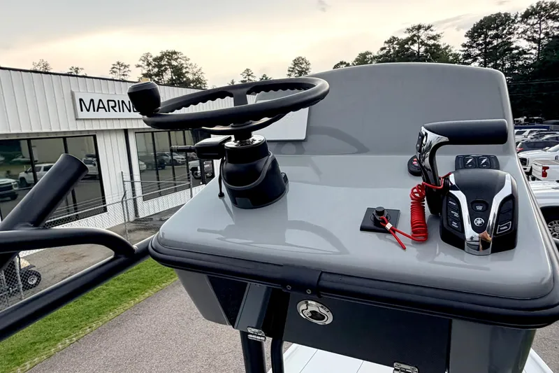 Slide: The Image of The image shows the helm of a 2026 Pathfinder 2500 Hybrid boat with modern controls. - 24