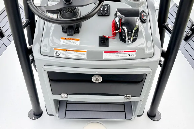 Slide: The Image of 2026 Pathfinder 2500 Hybrid boat console with steering wheel and controls. - 18