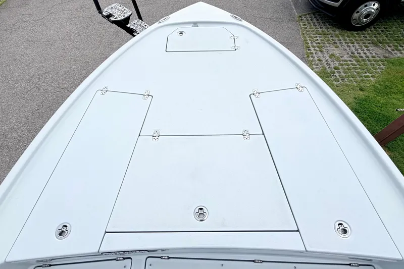 Slide: The Image of Bow deck of 2026 Pathfinder 2500 Hybrid boat with storage compartments. - 6