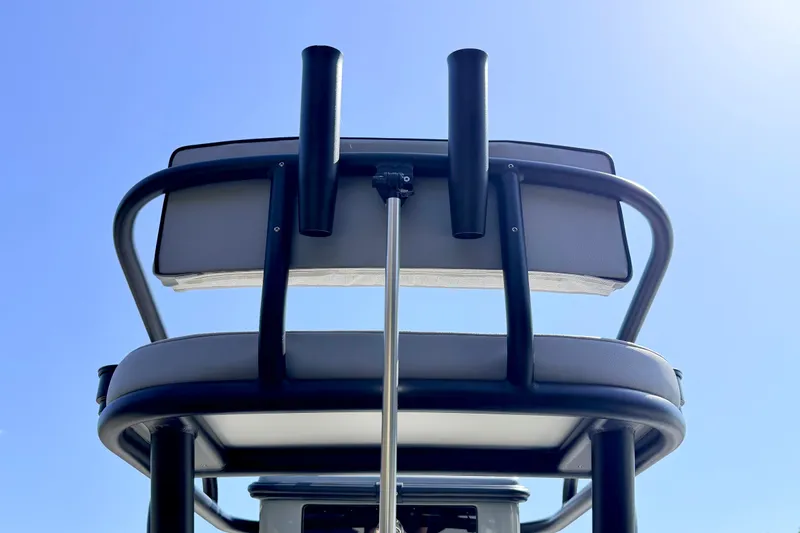 Slide: The Image of Pathfinder 2500 Hybrid 2026 boat seat and rod holders against clear blue sky. - 22