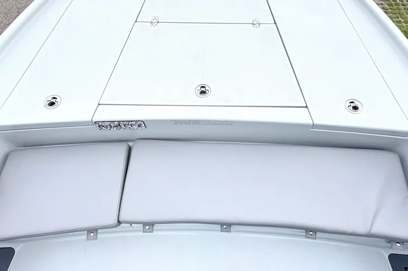 Slide: The Image of The image shows the deck of a Pathfinder 2500 Hybrid boat with cushioned seating areas. - 8