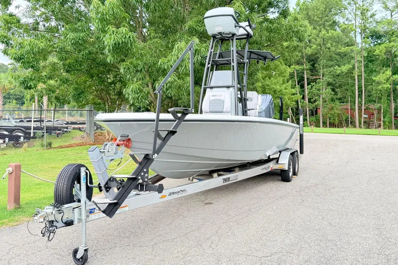 Slide: The Image of Pathfinder 2500 Hybrid 2026 on a trailer, surrounded by trees and a fence. - 1