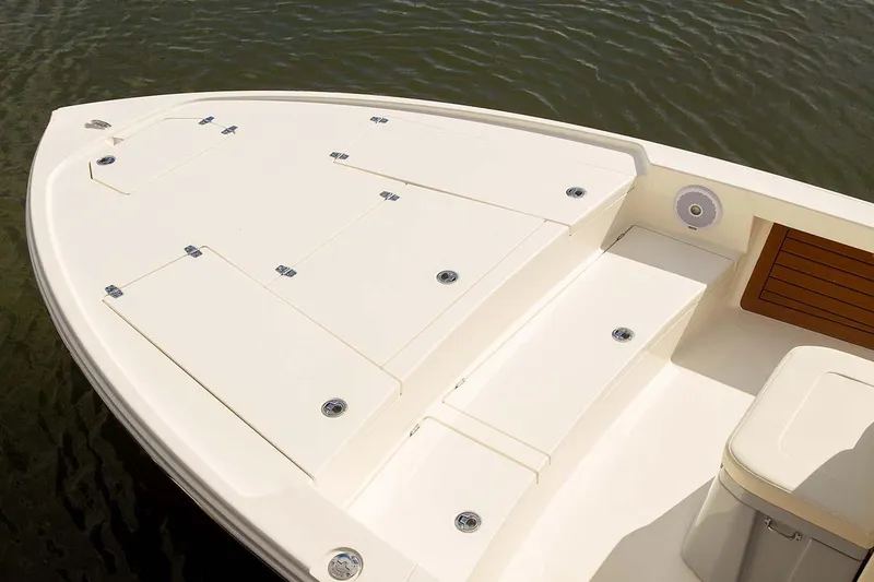 Slide: The Image of Manufacturer Provided Image: Bow of 2026 Pathfinder 2500 Hybrid boat with storage compartments, on calm water. - 30