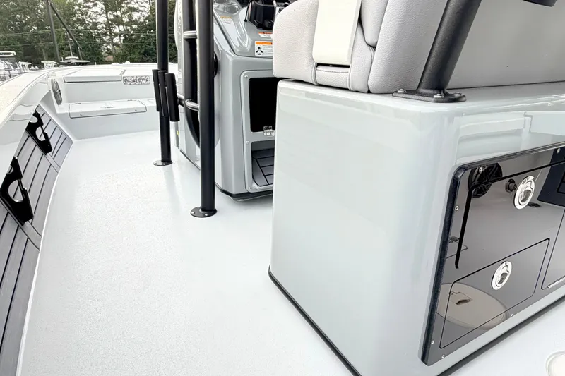 Slide: The Image of 2026 Pathfinder 2500 Hybrid boat interior with sleek seating and storage compartments. - 14