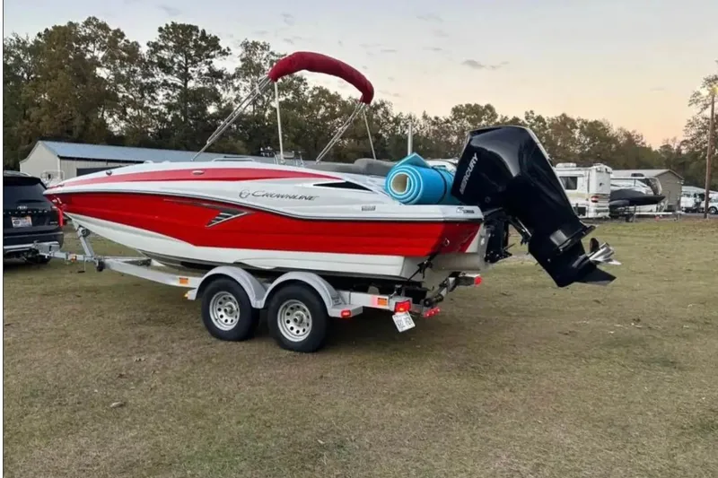Slide: The Image of 2021 Crownline Eclipse E205 XS boat on trailer, parked outdoors. - 3