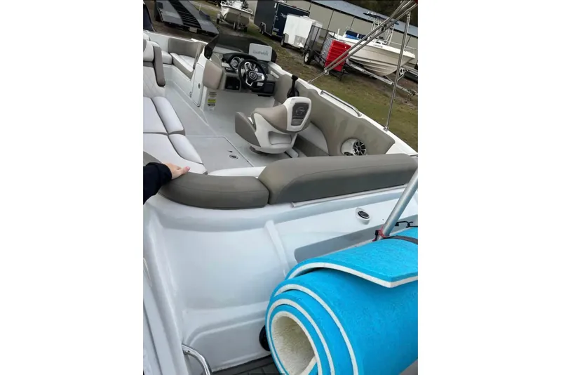 Slide: The Image of 2021 Crownline Eclipse E205 XS boat interior with seating and steering wheel. - 5