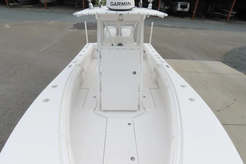 Slide: The Image of 2008 Onslow Bay 27 Offshore Edition boat with Garmin equipment, docked on concrete. - 11