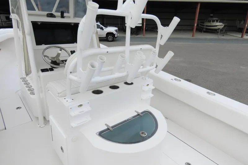 Slide: The Image of 2008 Onslow Bay 27 Offshore Edition boat interior with rod holders and steering console. - 14