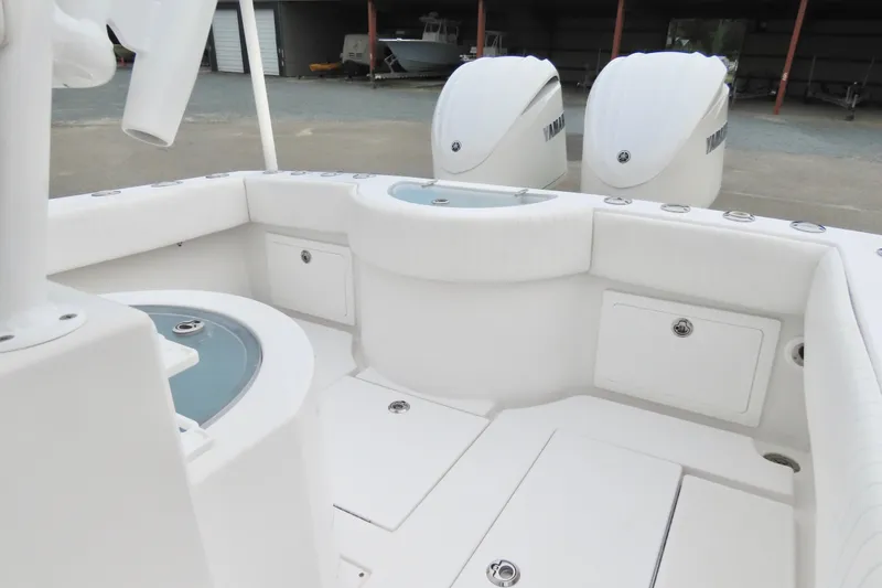 Slide: The Image of 2008 Onslow Bay 27 Offshore Edition boat interior with dual Yamaha engines. - 19