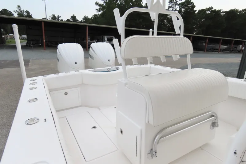 Slide: The Image of 2008 Onslow Bay 27 Offshore Edition boat interior with dual engines and seating. - 16