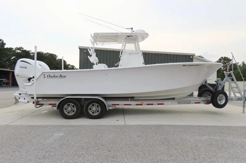 Slide: The Image of 2008 Onslow Bay 27 Offshore Edition boat on trailer, side view. - 7