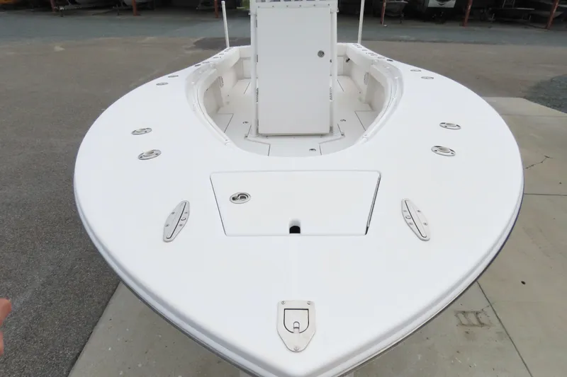 Slide: The Image of 2008 Onslow Bay 27 Offshore Edition boat, white deck view, docked on concrete surface. - 10