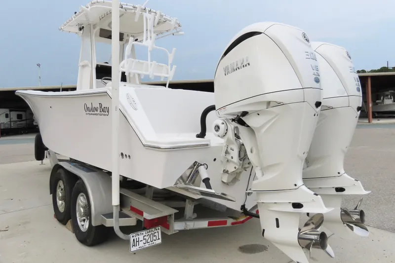 Slide: The Image of 2008 Onslow Bay 27 Offshore Edition boat with dual Yamaha outboard engines on a trailer. - 5