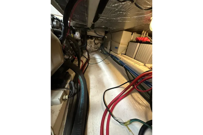 Slide: The Image of Engine room of 2007 True North 38 Heritage boat with visible wiring and components. - 102