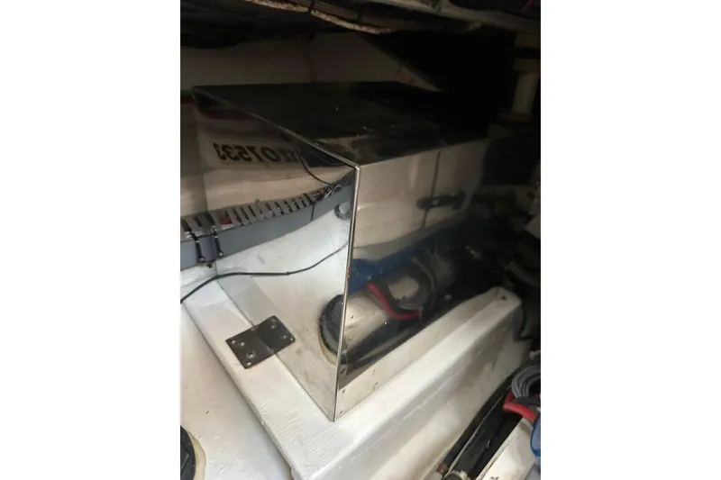 Slide: The Image of Engine compartment of 2007 True North 38 Heritage boat, featuring metallic components and wiring. - 98
