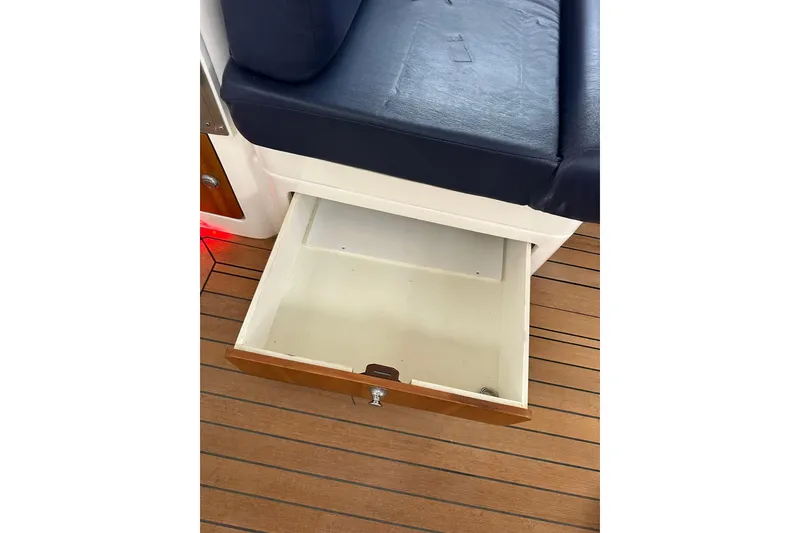 Slide: The Image of Open storage drawer under seat on 2007 True North 38 Heritage boat. - 107