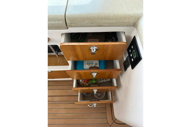Slide: The Image of Wooden drawers in a 2007 True North 38 Heritage boat interior, showcasing storage space. - 64