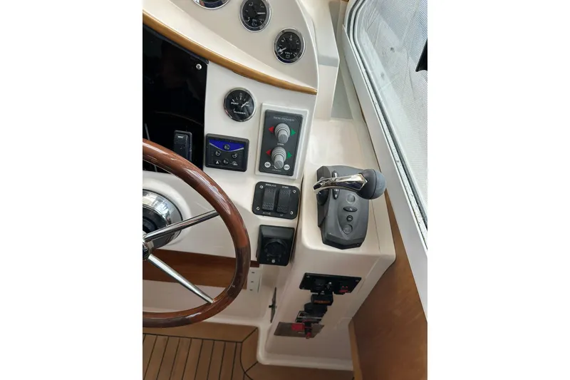 Slide: The Image of 2007 True North 38 Heritage boat helm with controls and gauges. - 70
