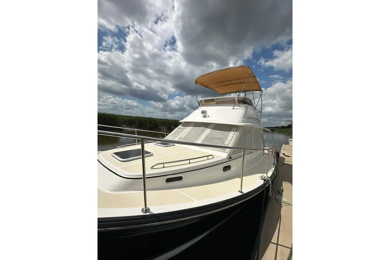 Slide: The Image of 2007 True North 38 Heritage yacht docked under cloudy sky. - 6