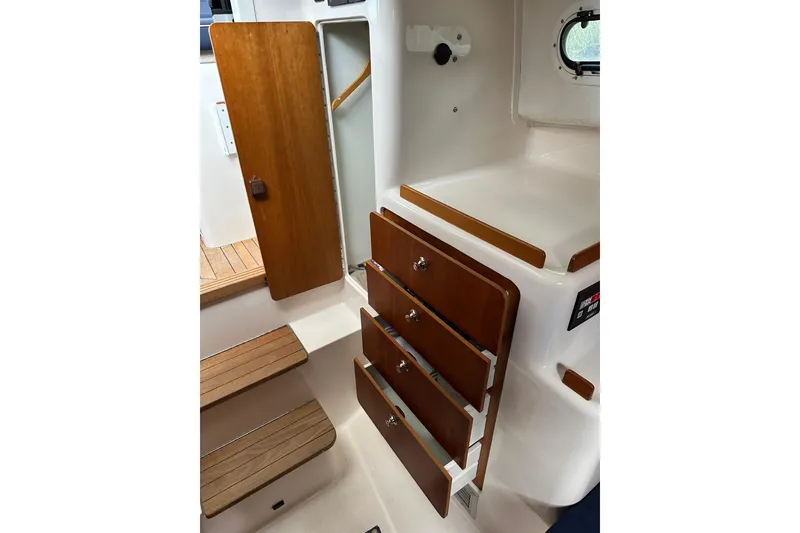 Slide: The Image of Interior of 2007 True North 38 Heritage boat with wooden cabinetry and steps. - 77